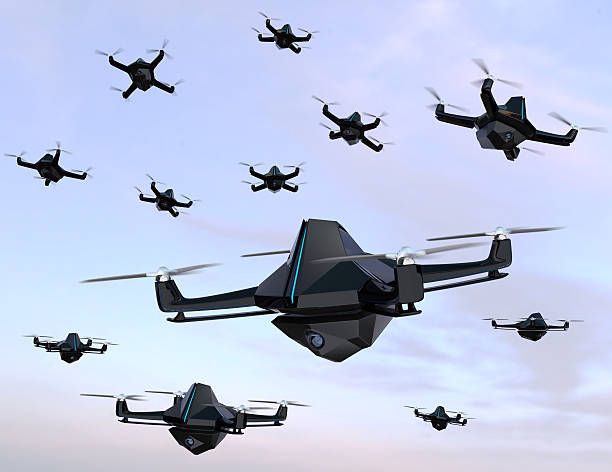 istock Swarm of drones flying in the sky 638714640