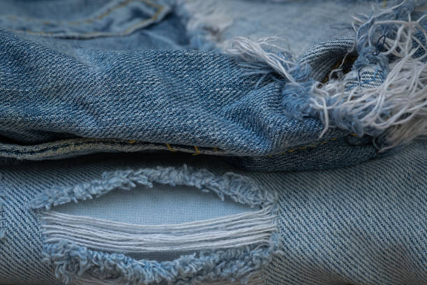 istock Closeup torn jean and old jean 638716710