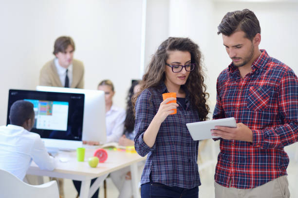 istock young startup business people, couple working on tablet computer 638717710