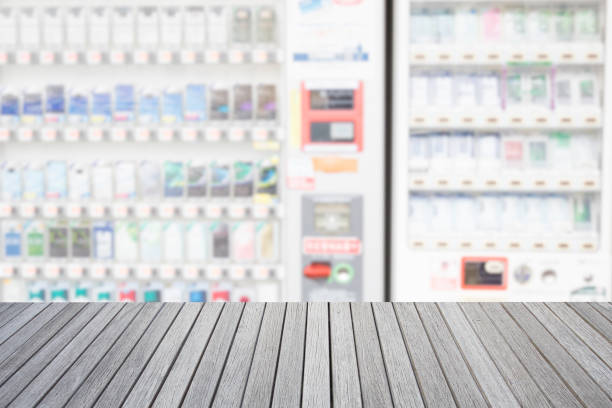 istock Empty top wooden table and blurred image of vending machine 638719488