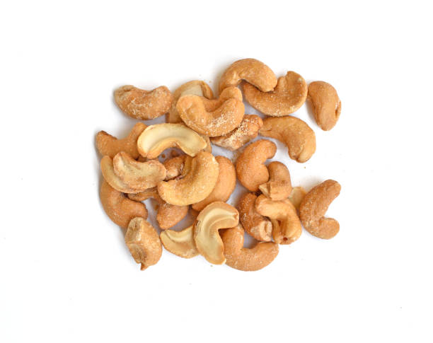 istock Roasted and salted cashew nut over white background 638719692