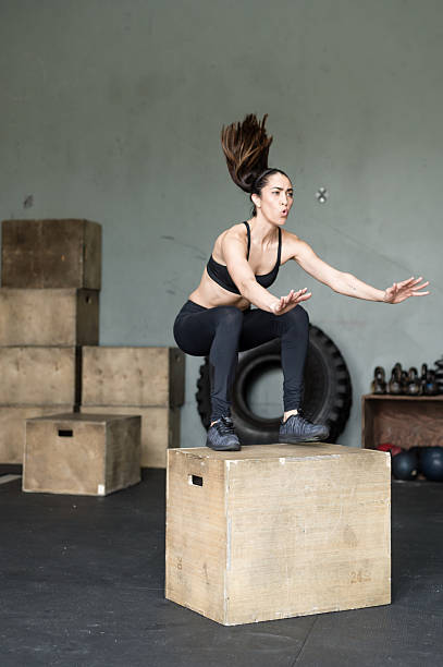 istock Beautiful Hispanic Women Working Out Box Jumps 638722670