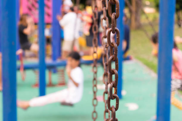 Swings at the playground in the park.