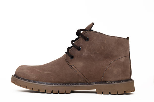 Men fashion leather brown boots isolated on white background.