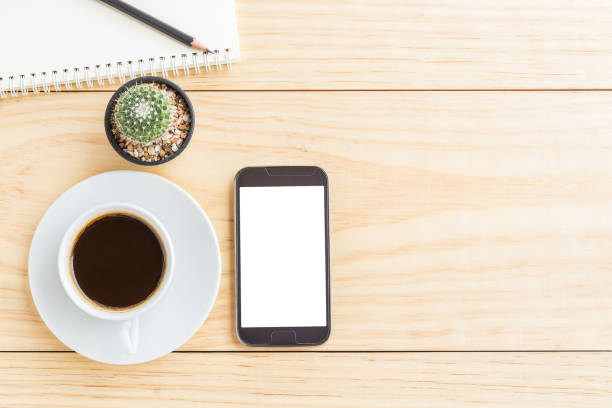 istock Vintage office desk table with smartphone,notebooks, pencil and 638725564