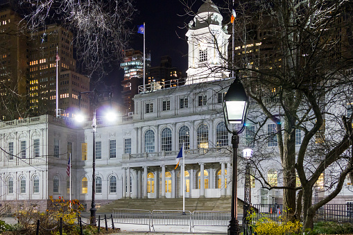NYC City Hall building with lights at night in Lower Manhattan, New York City