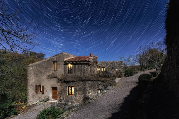 istock Old mill in Corsica at night with star trails above 638727122