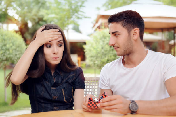 istock Surprised Woman Receiving Engagement Ring from Man 638728796