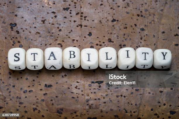 Stability Text On Wooden Cubes Stock Photo - Download Image Now - Alphabet, Care, Concepts