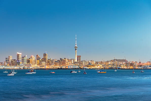 Auckland Cityscape Twilight New Zealand Beautiful illuminated cityscape of downtown Auckland during twilight. Auckland, New Zealand, Oceania. Waitemata Harbor stock pictures, royalty-free photos & images