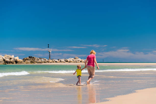 istock Grandmother with grandson on the beach 638734044