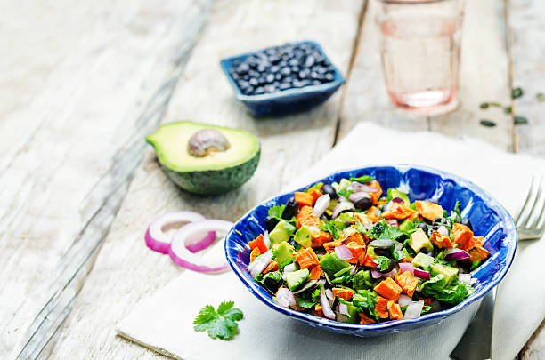 Roasted sweet potato black bean pepita avocado salad