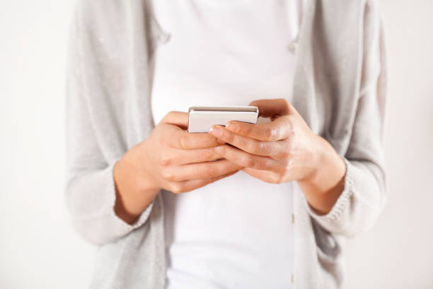 istock Woman hands holding phone 638734752