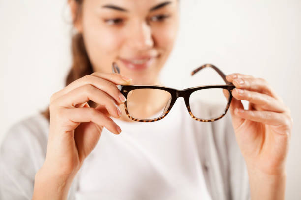 istock Woman hands holding eyeglasses 638735052