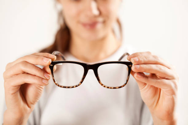 istock Woman hands holding eyeglasses 638736020