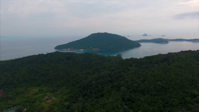 Aerial footage over tropical islands just after sunset