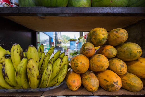 Exotic fruits on banana leaves background - papaya, mango, pineapple, banana, carambola, dragon fruit, lemon, orange, water melon, coconut, rambutan, mangosteen, longan, grape and passion fruit.
