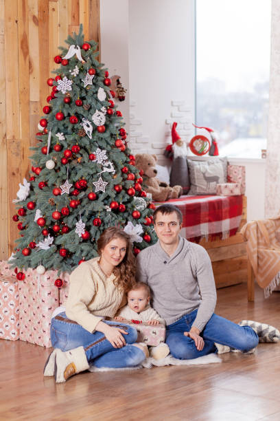istock happy family near Christmas tree 638739162