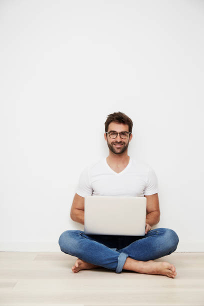 Laptop guy Laptop guy sitting on floor, portrait sitting on floor stock pictures, royalty-free photos & images