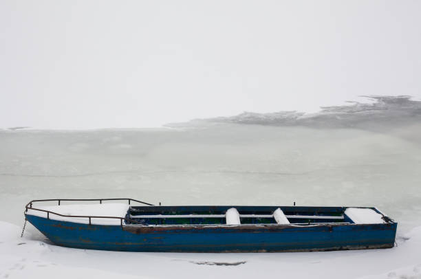 istock Blue Boat in Frozen River 638740164
