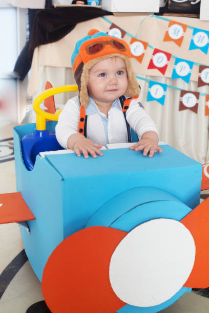 boy in airplane little cute game stock photo