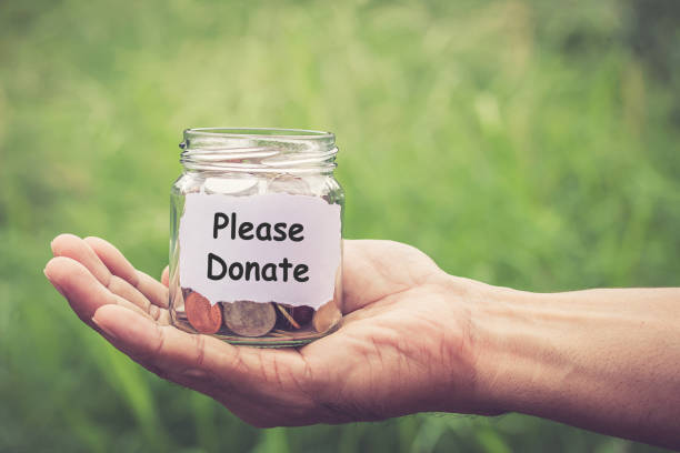 istock Hands holding money in the jar 638741986