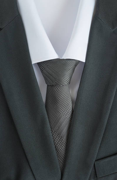 istock black men's suit with white shirt and grey tie 638745702