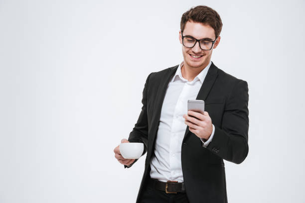 istock Business man using smartphone and holding cup of coffee 638746178