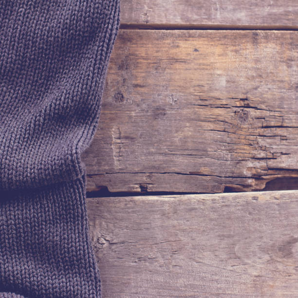 istock knitted plaid, sweater on old wooden boards 638747536