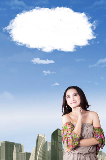 istock Young woman daydreaming with bubble cloud 638747566