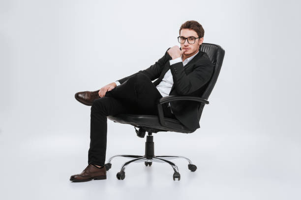 istock Businessman sitting on chair at studio. 638748366