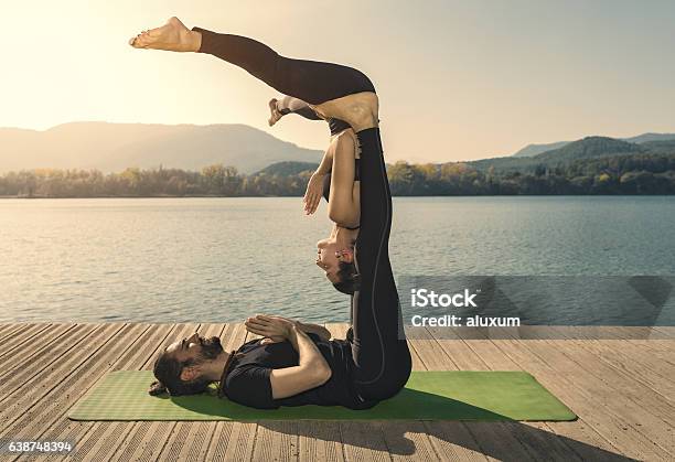 Acroyoga Straddle Bat Pose Stock Photo - Download Image Now - Couple - Relationship, Yoga, Acrobat