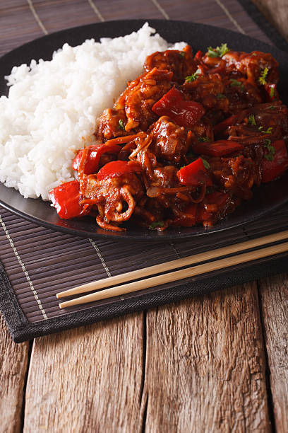 istock Pork with vegetables and garnish rice in Asian style. vertical 638748914