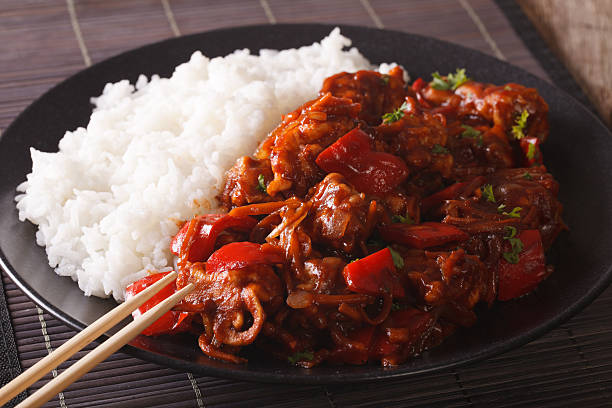 istock Asian Cuisine: Rice with pork in sweet and sour sauce 638749048