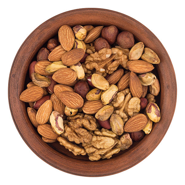 istock Mixture of nuts in a ceramic bowl 638750362