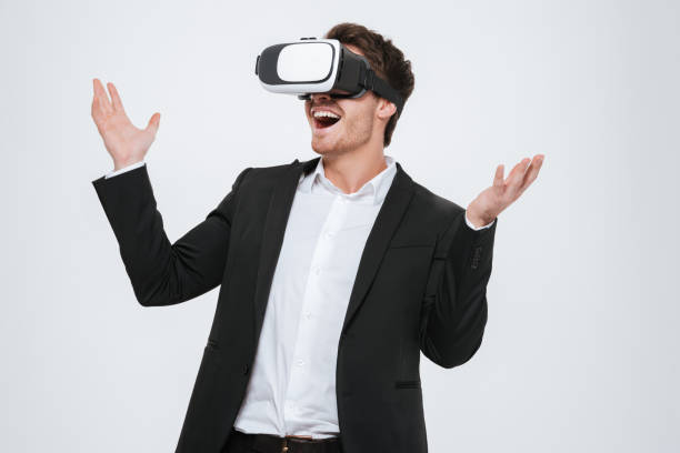 istock Businessman standing at studio wearing 3d glasses 638750394