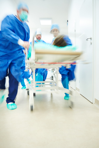 Doctors running to the operating room