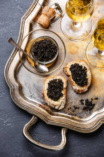 istock black caviar, sandwiches and champagne 638751560