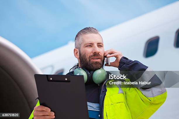 Ground Crew In Front Of Airplane Stock Photo - Download Image Now - Airport, Occupation, Air Vehicle