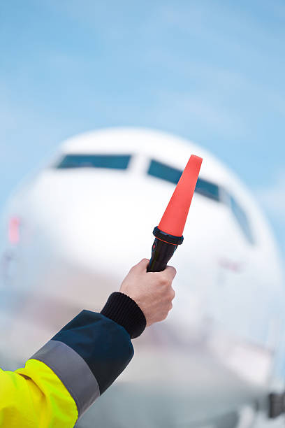 istock Air traffic controler holding signals 638751868