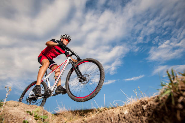 istock Mountain cyclist riding donwhill against blue evening sky 638751982