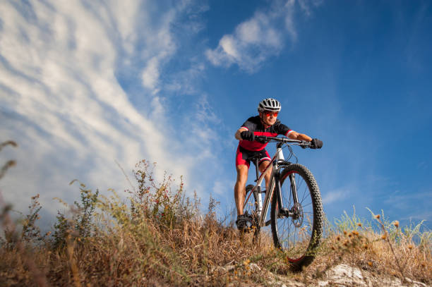 istock Cyclist riding his bike down on mountain trail 638753486