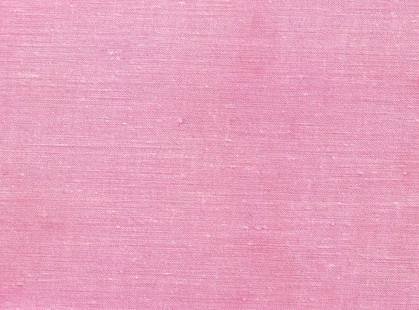 pink color textile pattern Pink color textile pattern. Abstract background and texture for design and text. linen flax textile burlap stock pictures, royalty-free photos & images