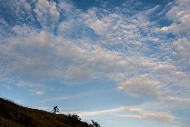 istock Silhouette of a cross country cyclist going downhill 638753634