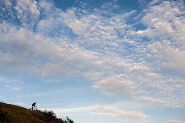 istock Silhouette of a cross country cyclist going downhill 638753690