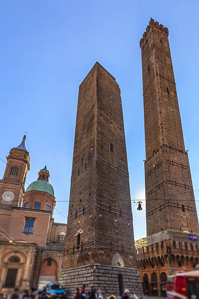 The two towers Asinelli, 97 meters high, and Garisenda, 47 meters high, are the symbols of Bologna. They date back to the early twelfth century. Emilia Romagna, Italy. (selective focus)
