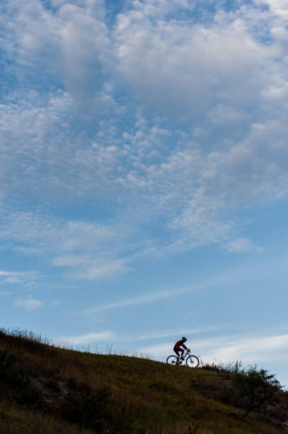 istock Silhouette of a cross country cyclist going downhill 638753866