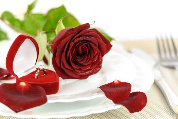 istock Gold engagement ring and red rose 638755056