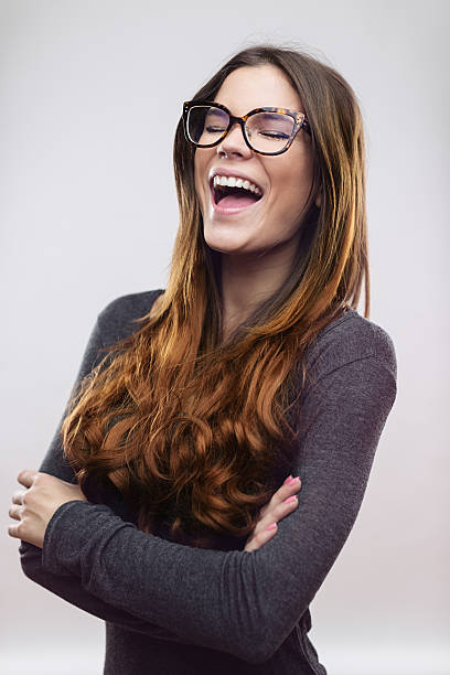 istock Cheerful woman laughing against white background 638755154