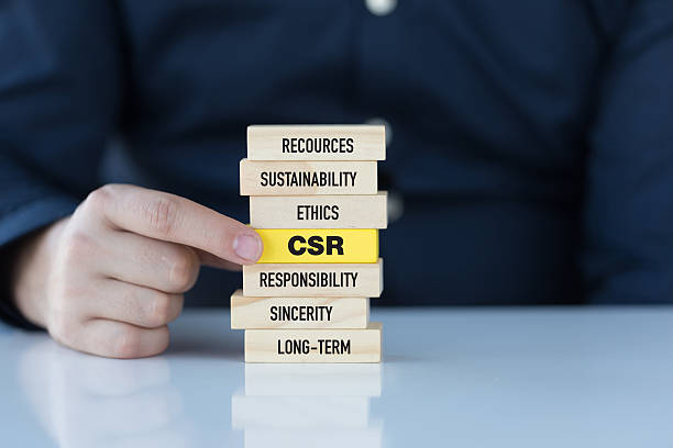 Corporate Social Responsibility Concept with Related Keywords on Wooden Blocks stock photo